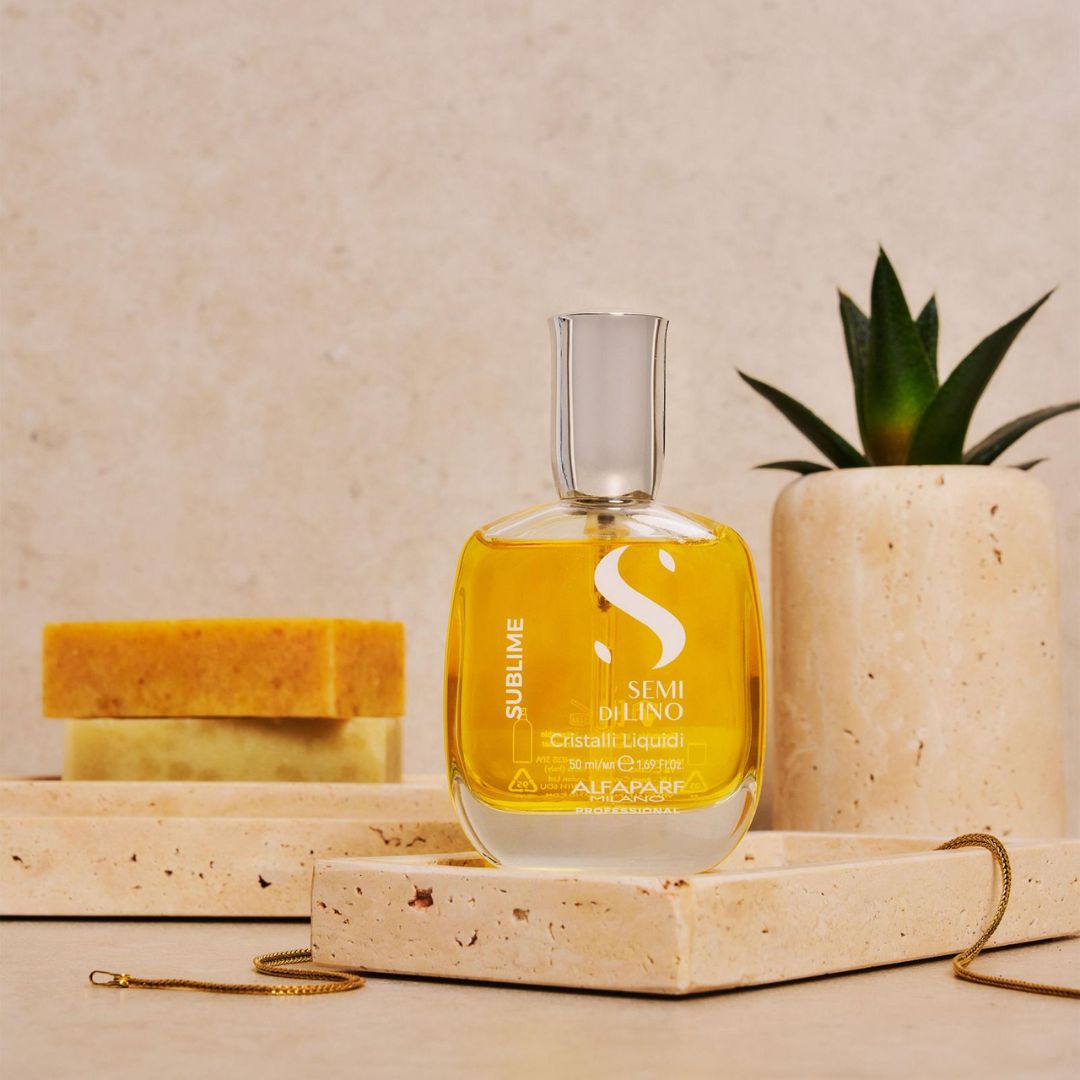 Yellow bottle labeled 'SUBLIME' with a plant and soap on a beige surface
