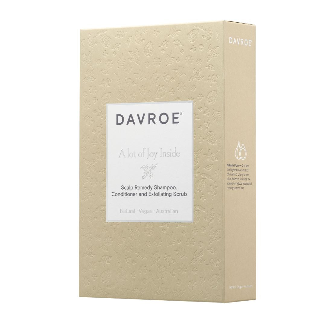Davroe Scalp Remedy Shampoo, Conditioner and Exfoliating Scrub box packaging, featuring a textured beige box with a white label on a white background.