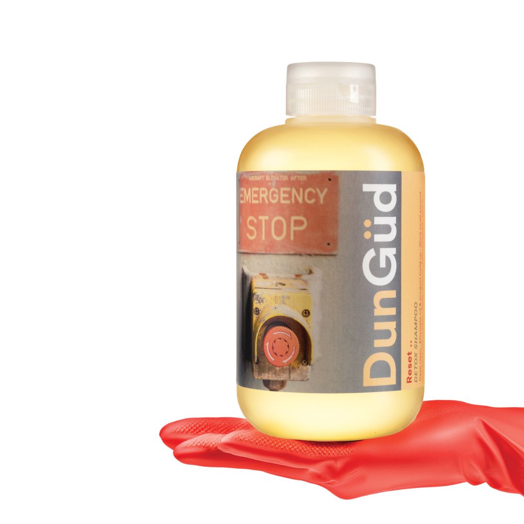 DunGöd bottle with red glove on a white background