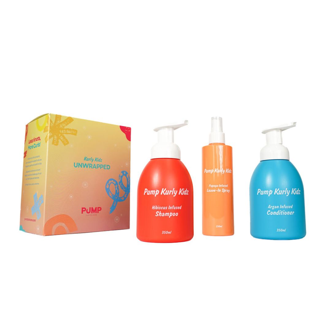 Pump Karly Kids Body Kit Unwrapped set featuring a colorful box and three bottles: red shampoo, orange laundry detergent, and blue conditioner, on a white background.