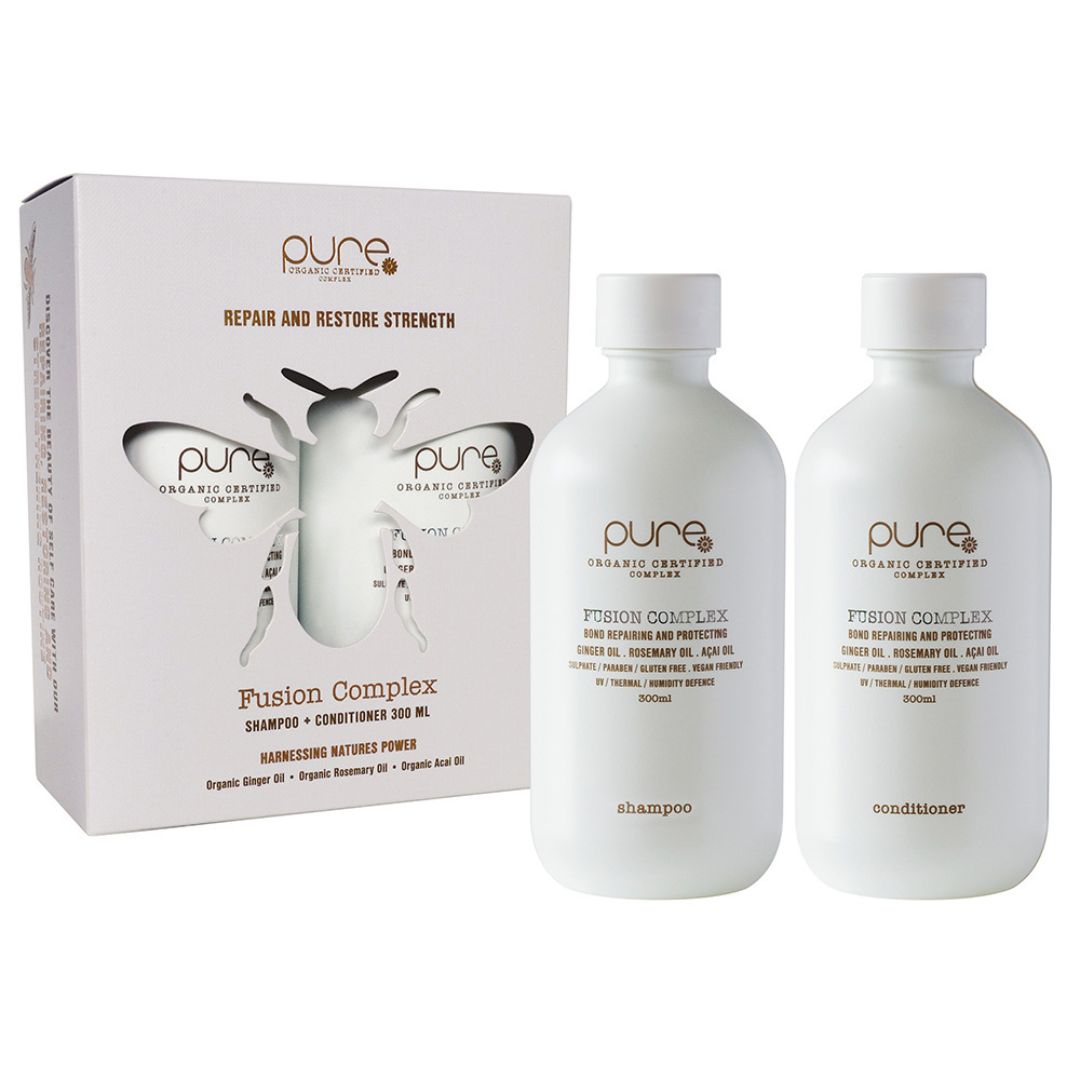 Two bottles of 'pure' Fusion Complex shampoo and conditioner with packaging on a white background