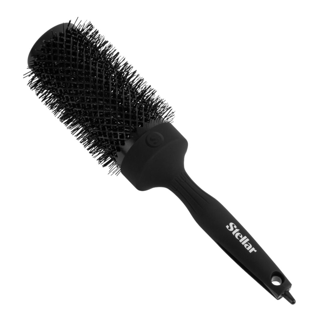 Black hairbrush with bristle head and handle on a white background, branded 'Stellar'.