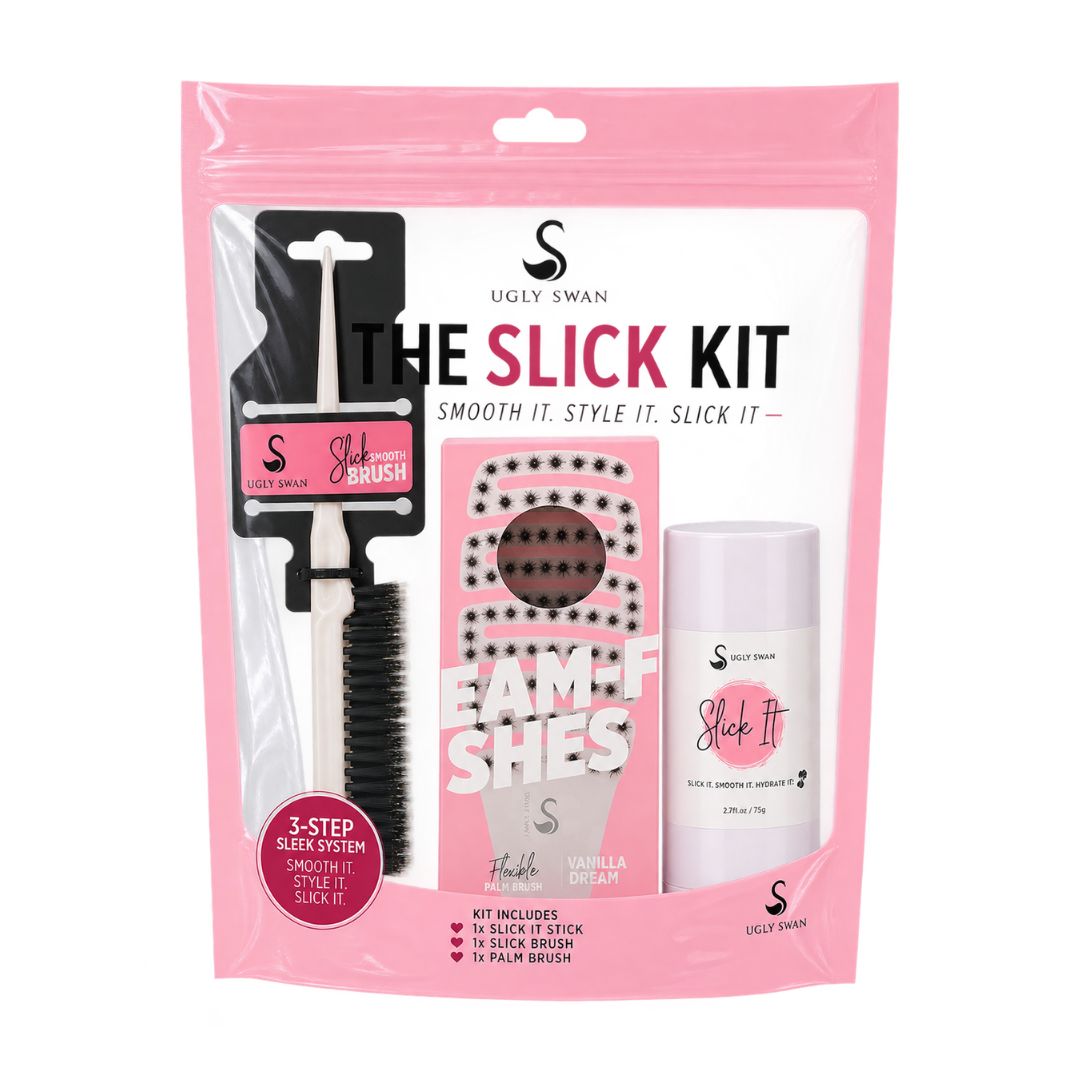 Ugly Swan The Slick Kit in a pink resealable pouch, containing a black and white slick brush, a pink foam shield, and a white vanilla bean hair stick.