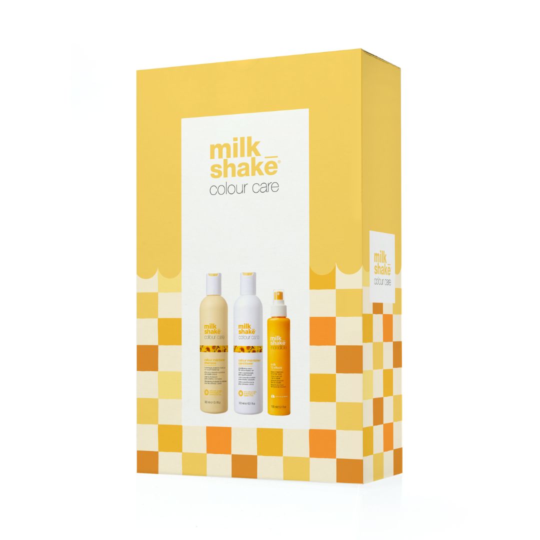 A Milk Shake Colour Care hair product set in a yellow and white box, featuring three bottles of hair color and care products on a clean white background.