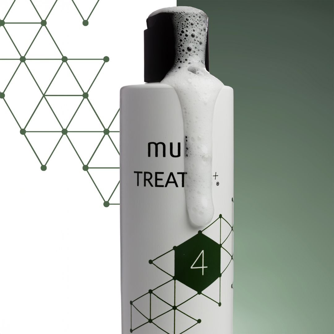 Bottle of 'muse' treatment with geometric design on a gradient background