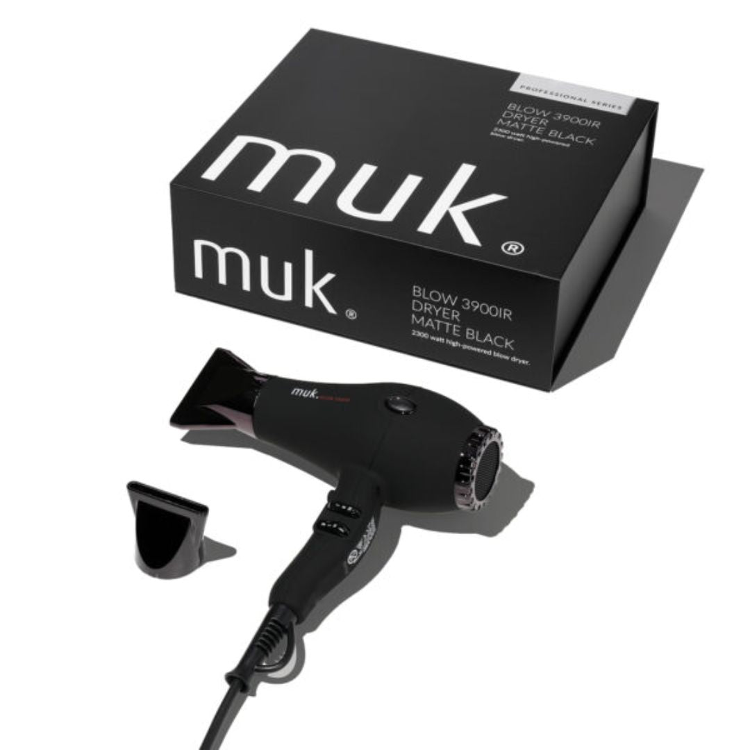 Black hair dryer with attachments and packaging displaying 'muk' brand on a white background