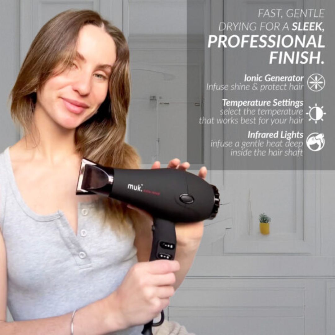 Woman holding a black hair dryer with text about its features on a gray background