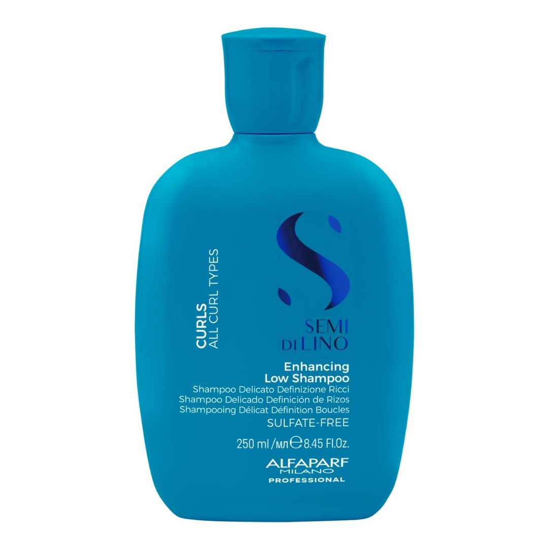 A bottle of Alfani Alafarf Professional Semi Dilino Enhancing Low Shampoo for curls and all curl types, in a vibrant blue bottle with a matching cap, on a solid white background.
