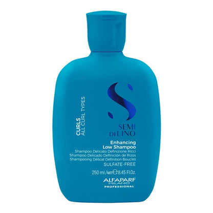 A bottle of Alfani Alafarf Professional Semi Dilino Enhancing Low Shampoo for curls and all curl types, in a vibrant blue bottle with a matching cap, on a solid white background.