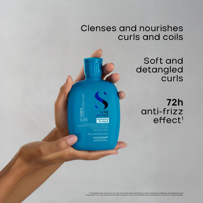A hand holding a bright blue Sumi Blango curling and defining treatment bottle against a light gray background, with black text describing benefits: 'Clenges and nourishes curls and coils', 'Soft and detangled curls', and '72h anti-frizz effect'.