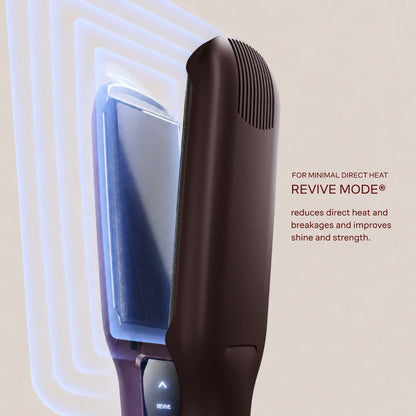 A close-up of a hair straightener in dark brown with a blue interior heating plate, shown with graphic heat-wave lines and text reading 'FOR MINIMAL DIRECT HEAT REVIVE MODE® reduces direct heat and breakages and improves shine and strength.'.