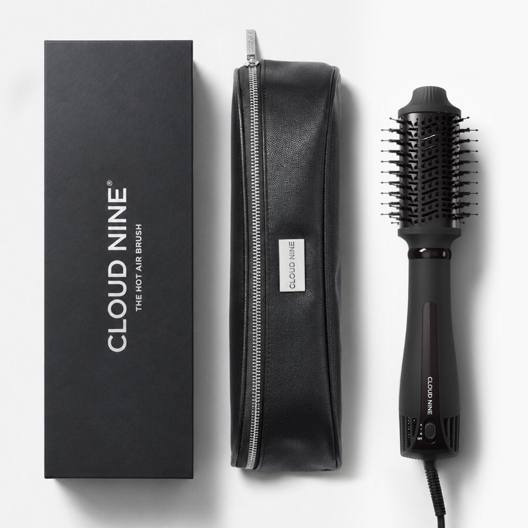 Cloud Nine hot air brush set with a black branded box, a black zippered pouch, and the black hot air brush on a light gray background.