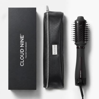 Cloud Nine hot air brush set with a black branded box, a black zippered pouch, and the black hot air brush on a light gray background.