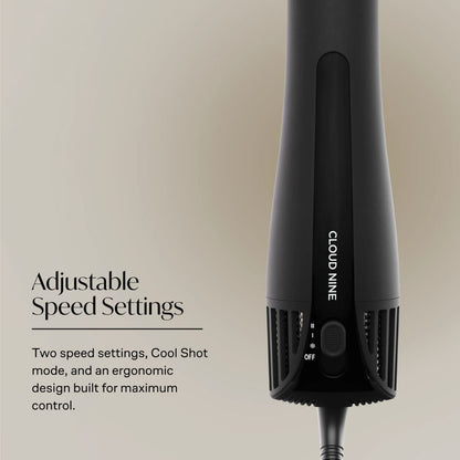 A black hair dryer shown on a warm beige background with text reading 'Adjustable Speed Settings' and 'Two speed settings, Cool Shot mode, and an ergonomic design built for maximum control.' The dryer is branded 'CLOUD NINE.