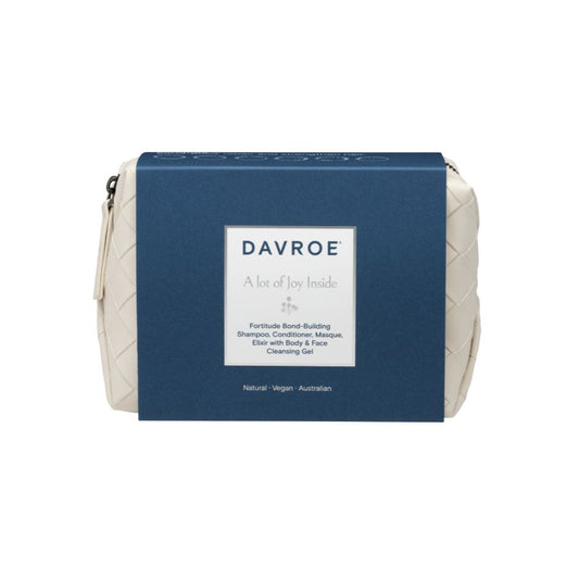 Davroe Fortitude Bond-Building Shampoo Conditioner Medium in a blue zippered pouch with a white woven-texture side panel and a central white label.