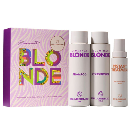 De Lorenzo Illuminate Blonde Hair Care set featuring a purple and pink patterned box alongside three white bottles: Shampoo, Conditioner, and Instant Treatment spray.
