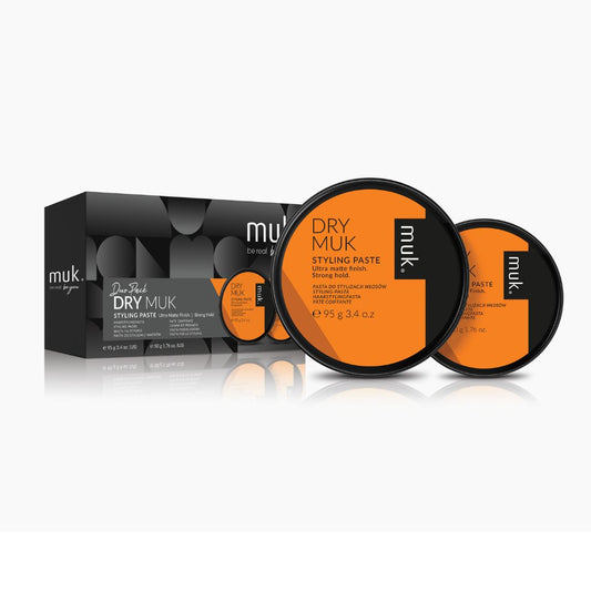 Dry Muk styling paste packaging with black and orange design on a white background