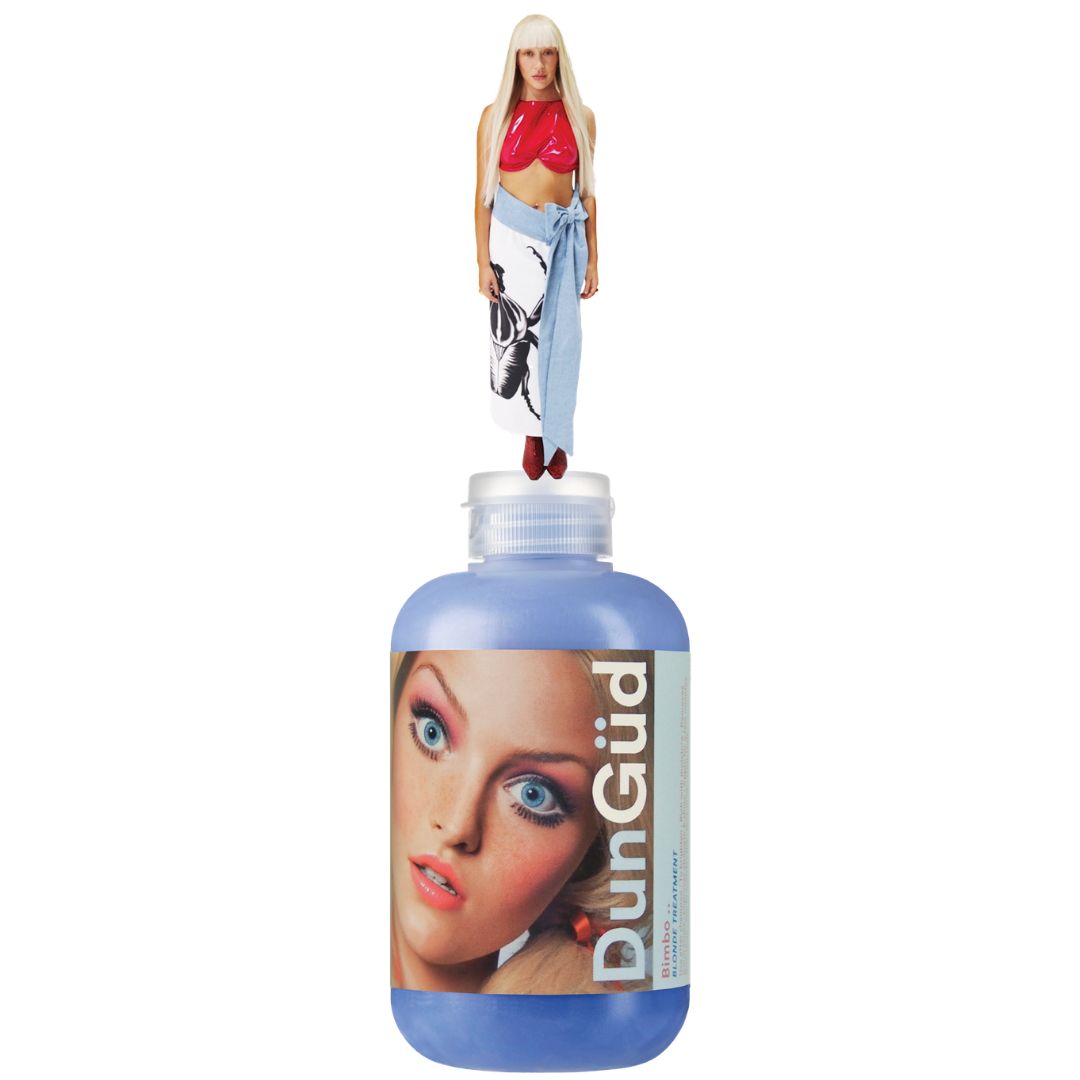 Bottle of DunGud hair product with a doll on top against a white background