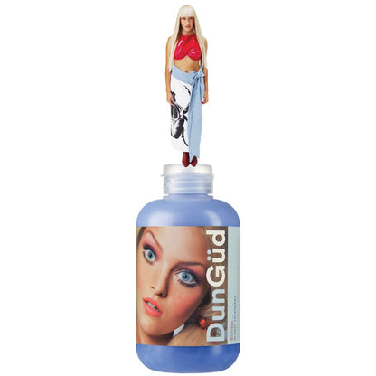 Bottle of DunGud hair product with a doll on top against a white background
