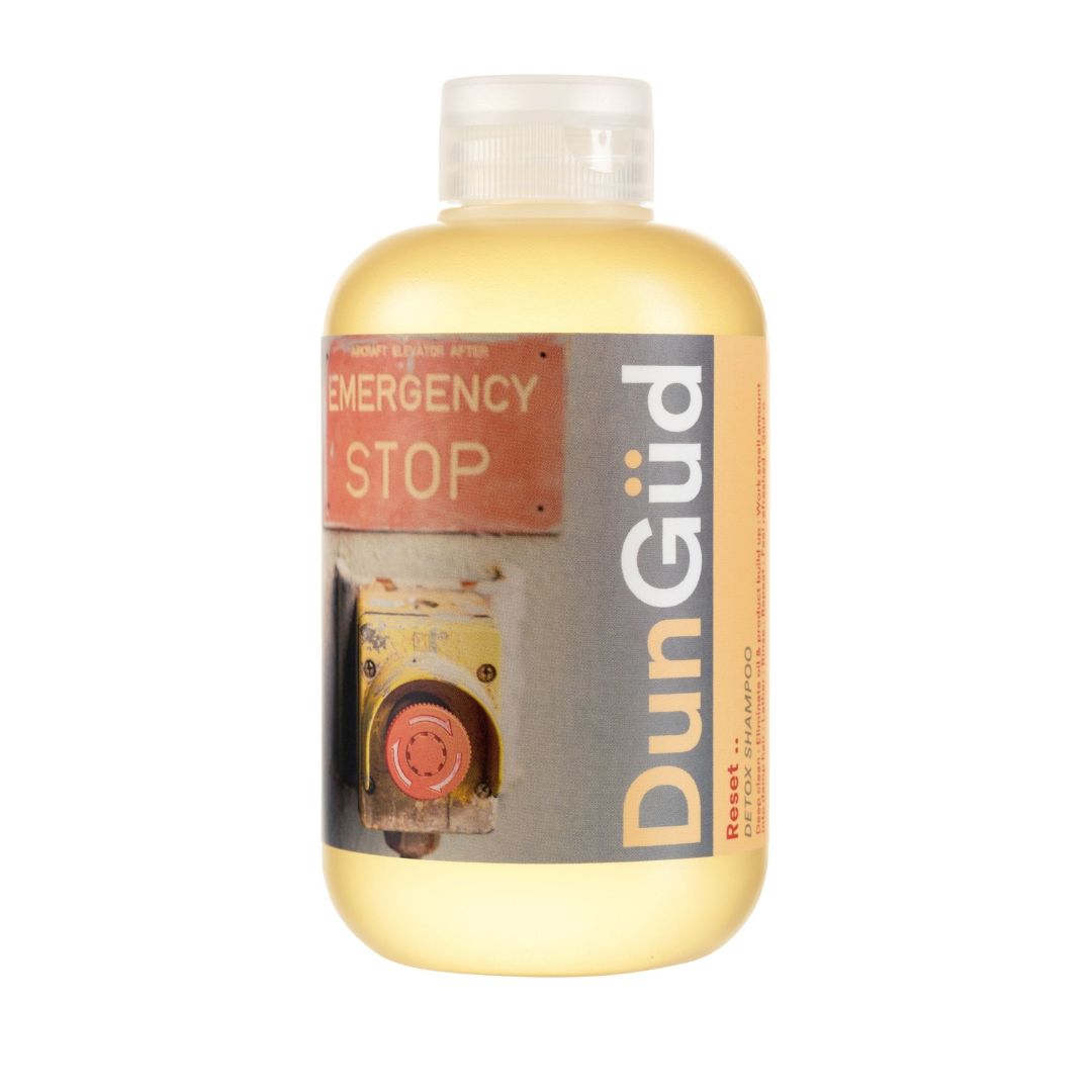 Bottle of DunGöd with a label indicating 'Emergency Stop' on a white background