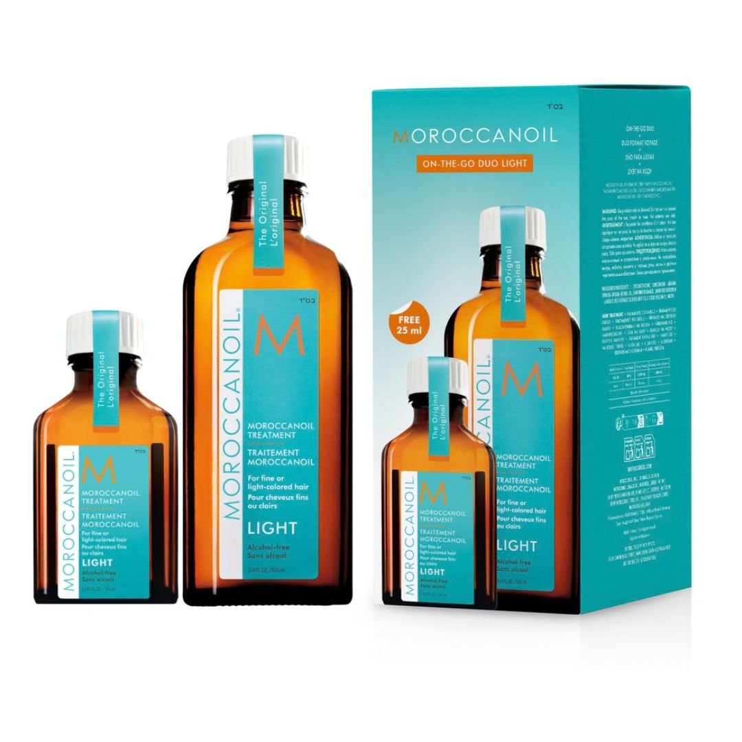 Moroccanoil On The Go Duo Light hair care set featuring three amber glass bottles of different sizes with turquoise labels and a matching turquoise product box on a white background.