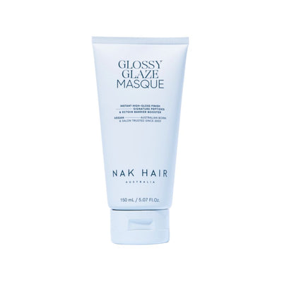 A 150 mL squeeze tube of NAK HAIR Glossy Glaze Masque, featuring a pale icy blue design with dark blue text, set against a solid white background.