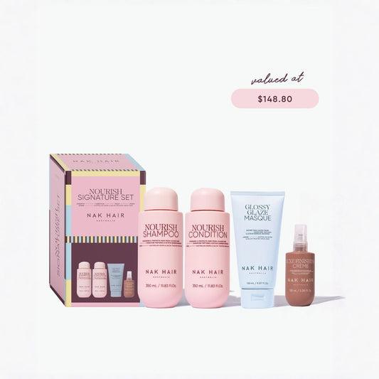 Nak Hair Nourish Signature Set featuring a pink and gold gift box, two pink bottles of nourish shampoo and nourish condition, a light blue tube of glossy nourish masque, and a brown bottle of nourish cream, displayed on a clean white background with a '$148.80' price badge.