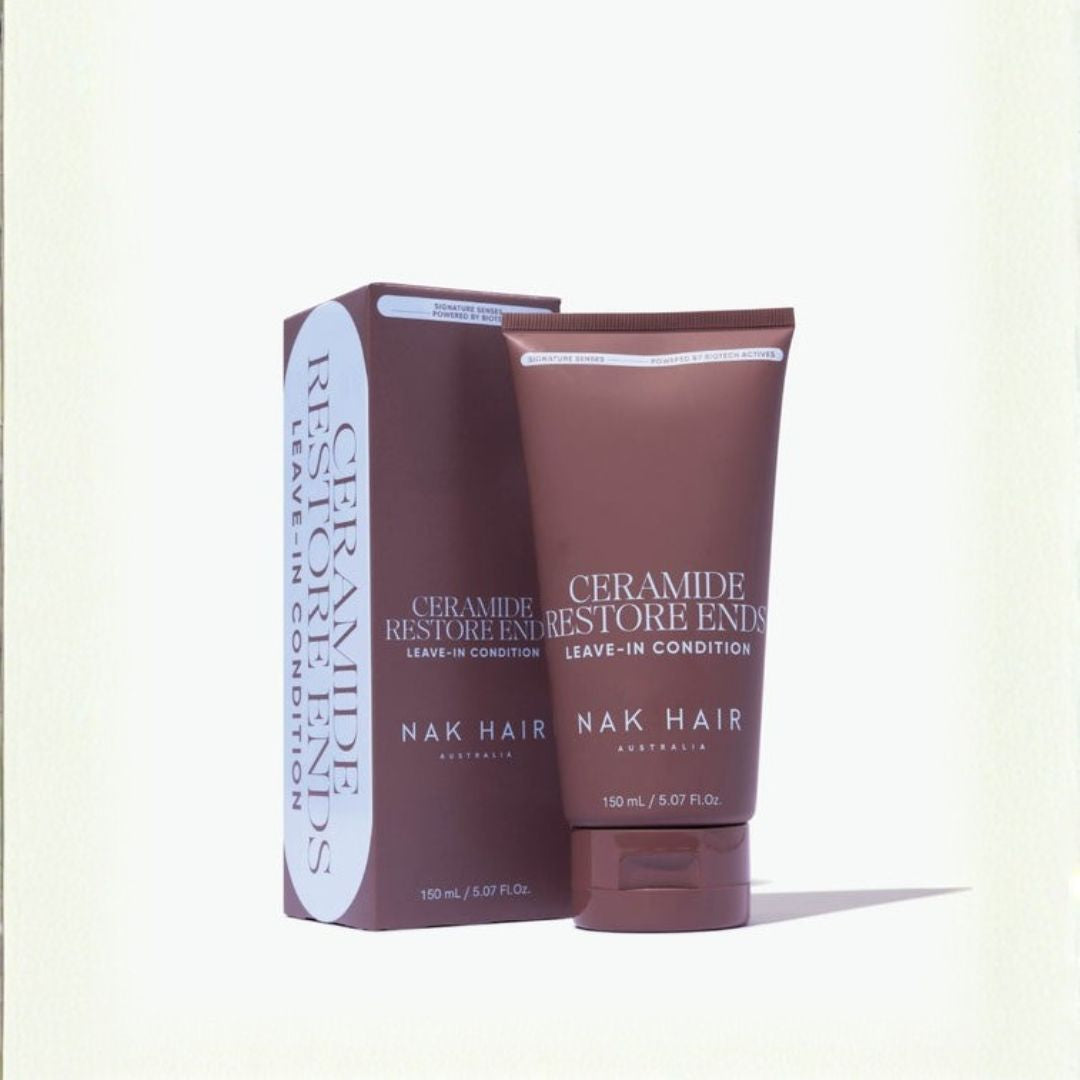 Nak Hair Ceramide Restore Ends leave-in conditioner in a brown squeeze tube next to its matching brown packaging box, set against a plain off-white background.