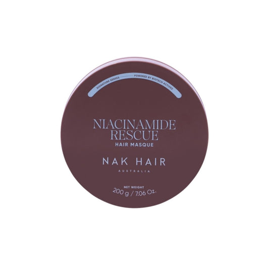 A round tin of Niacinamide Rescue Hair Masque by NAK HAIR, featuring a dark plum-brown lid with white and light blue text, set against a plain white background.
