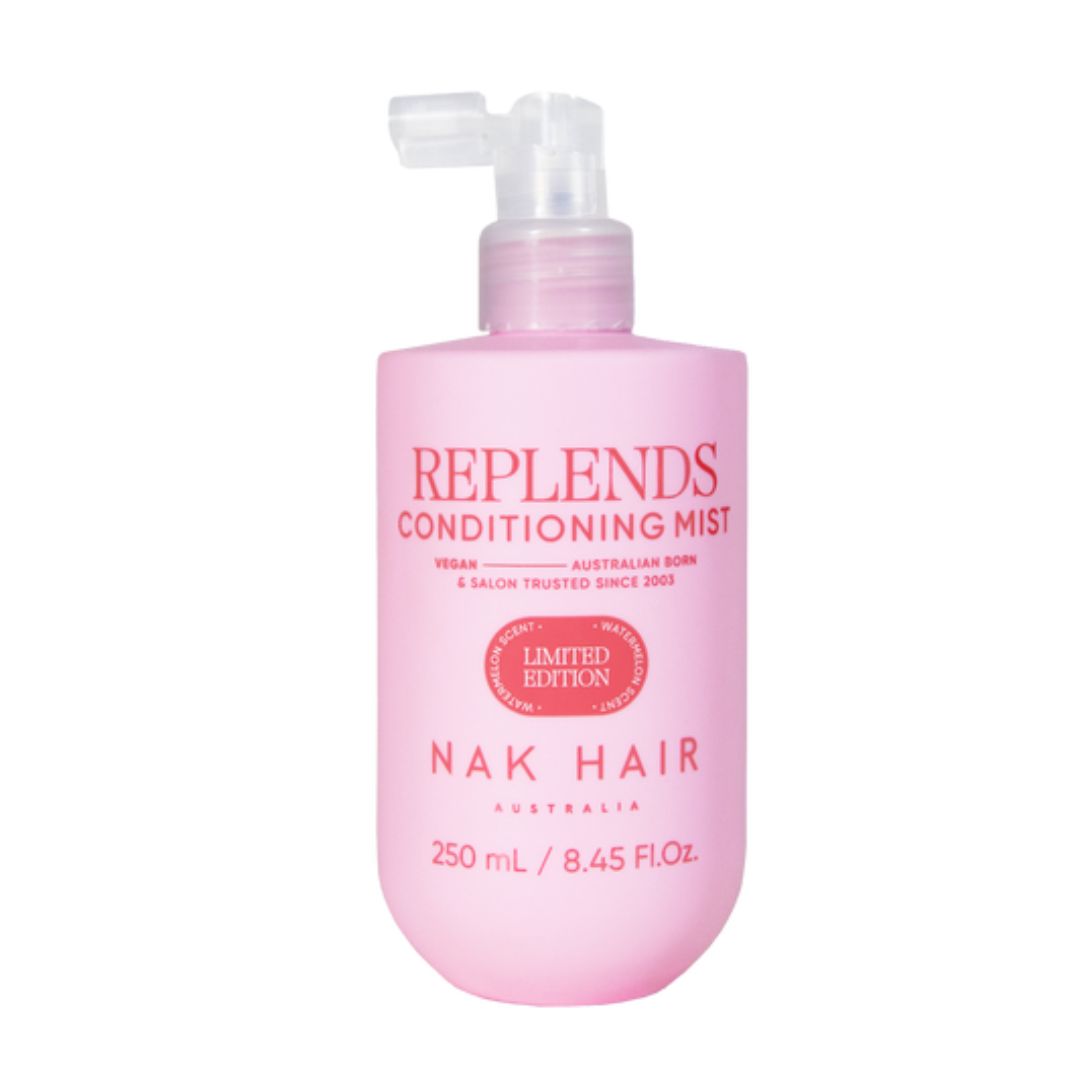Pink bottle of Replends Conditioning Mist by Nak Hair on a white background