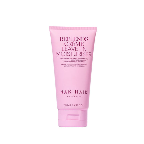 A pink tube of NAK Signature Replends Creme Leave in Moisturiser, 150ml size, designed for moisturizing and softening hair.