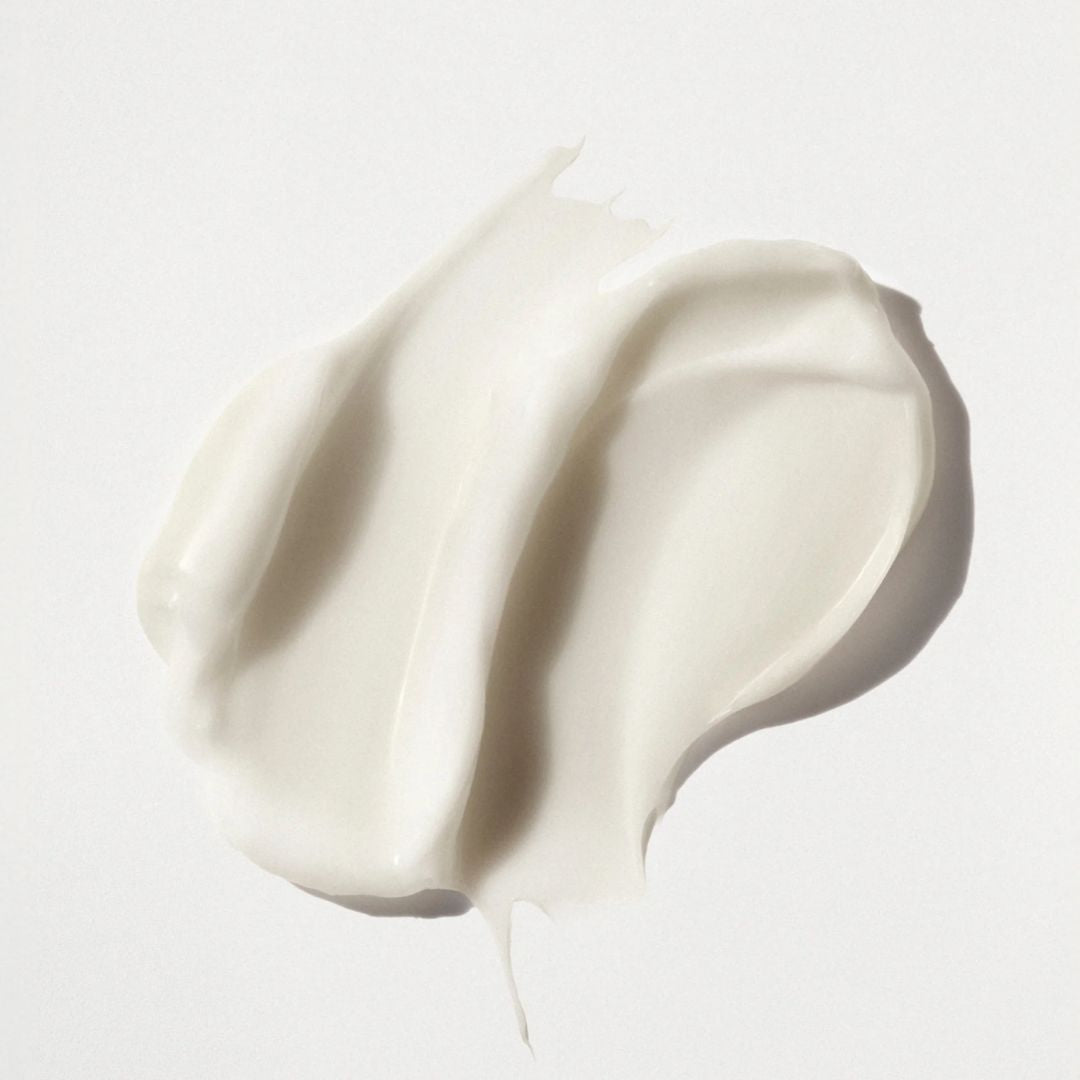 White cream or yogurt swatch on a light gray background
