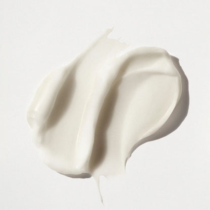 White cream or yogurt swatch on a light gray background