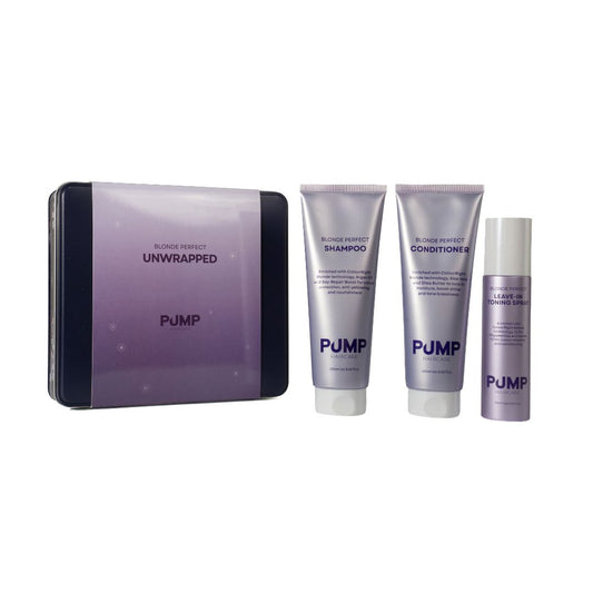PUMP Blonde Perfect Unwrapped hair care set featuring a rectangular tin and three matching tubes and bottle in a light purple and silver color scheme, shown on a white background.