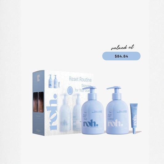 A skincare set from roh. called Reset Routine, featuring a light blue and white box, two pump bottles, and a tube, displayed on a clean white background with a 'valued at $84.