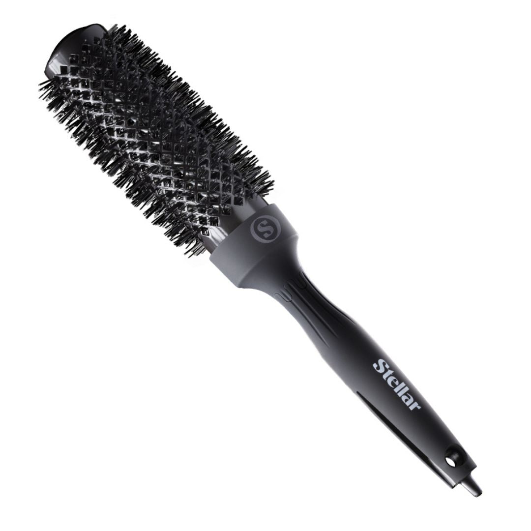 Black round hairbrush with gray handle on a white background