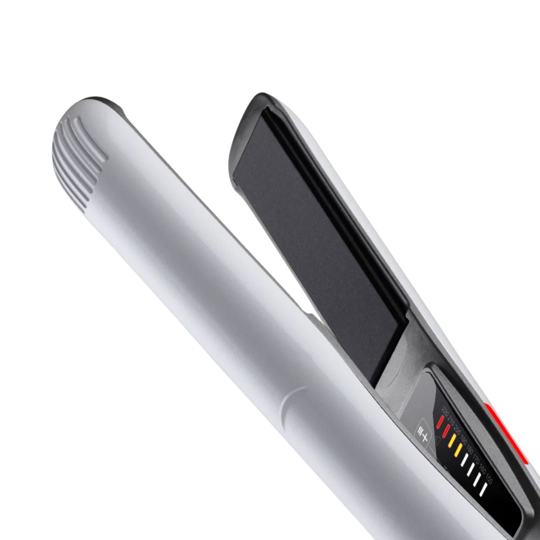 Silver hair straightener on a white background