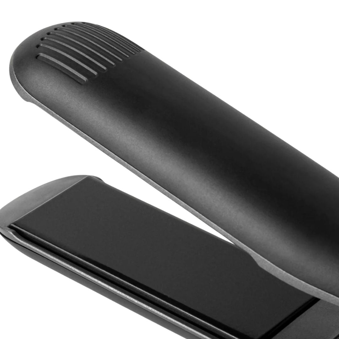 Black hair straightener on a white background