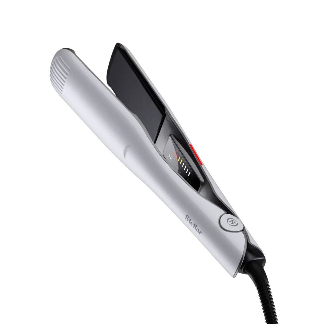 Silver hair straightener on a white background