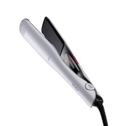 Silver hair straightener on a white background
