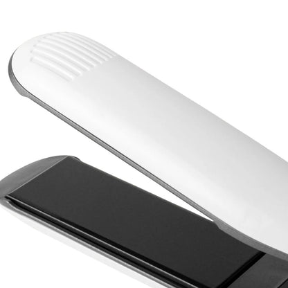 Close-up of a white electronic device with a black component on a white background