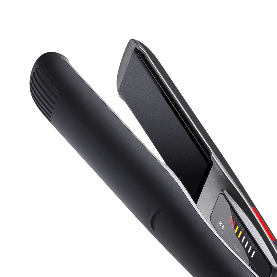 Black hair straightener on a white background