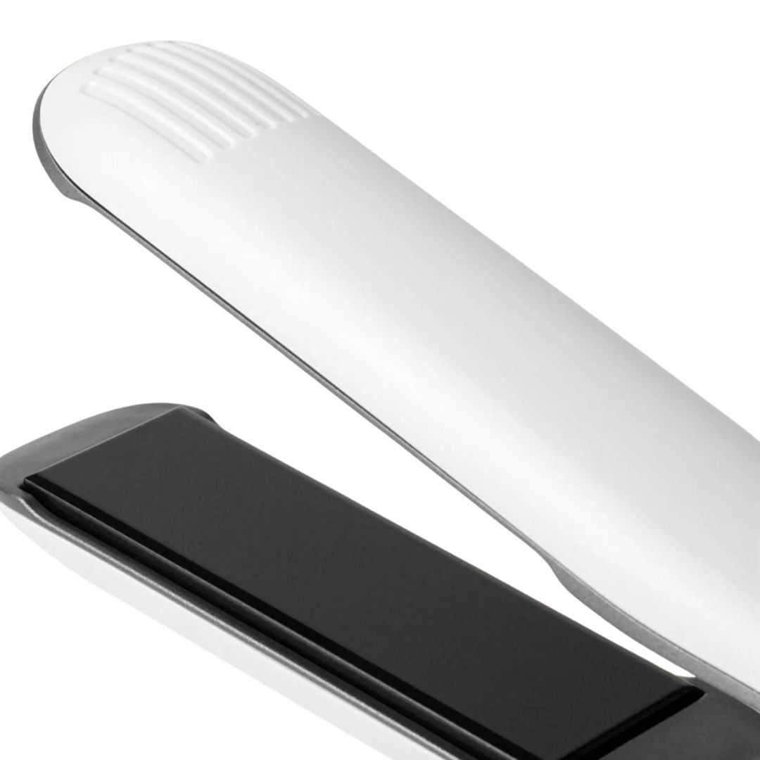 Close-up of a silver and black electronic device on a white background