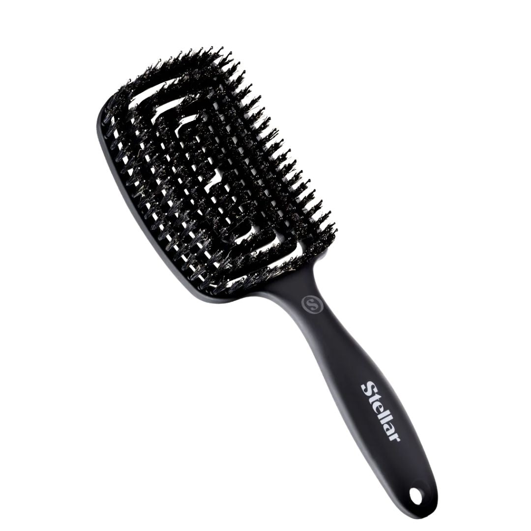 Black hairbrush with 'Stellar' branding on a white background
