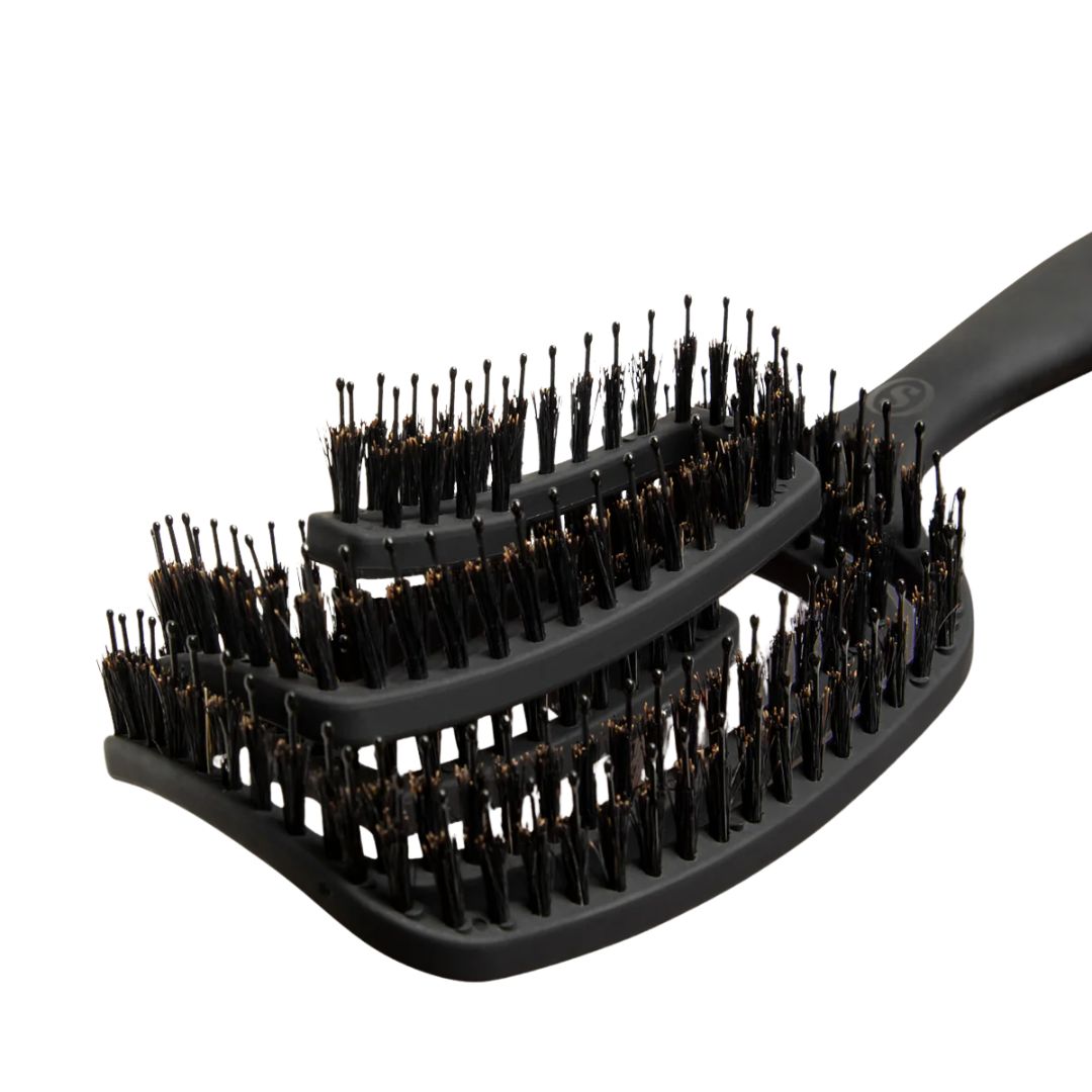 Black hairbrush with bristle design on a white background