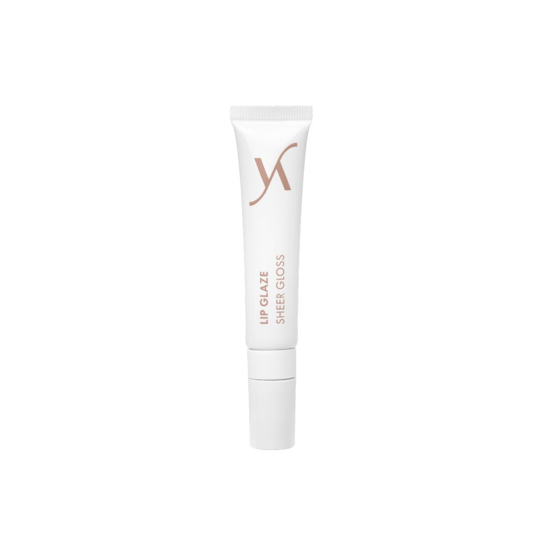 A white squeeze tube of XN Lip Glaze Sheer Gloss with rose gold lettering, centered on a plain white background.