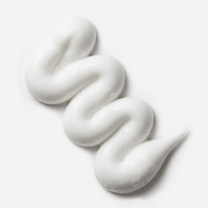 White cream or soap swirled on a white background