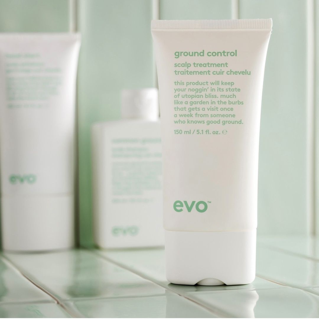 Evo ground control scalp treatment tube on a bathroom counter