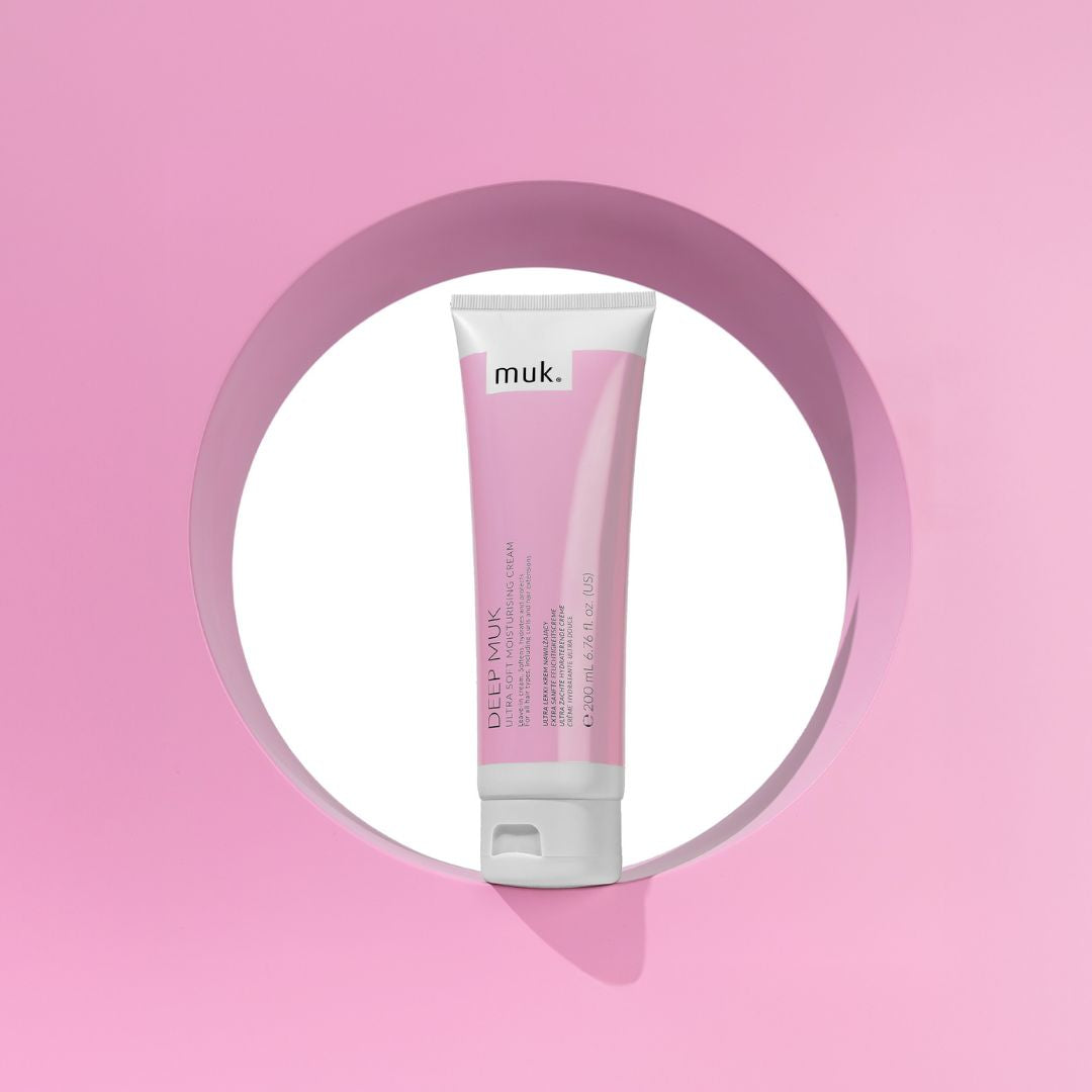Tube of muk product on a pink background