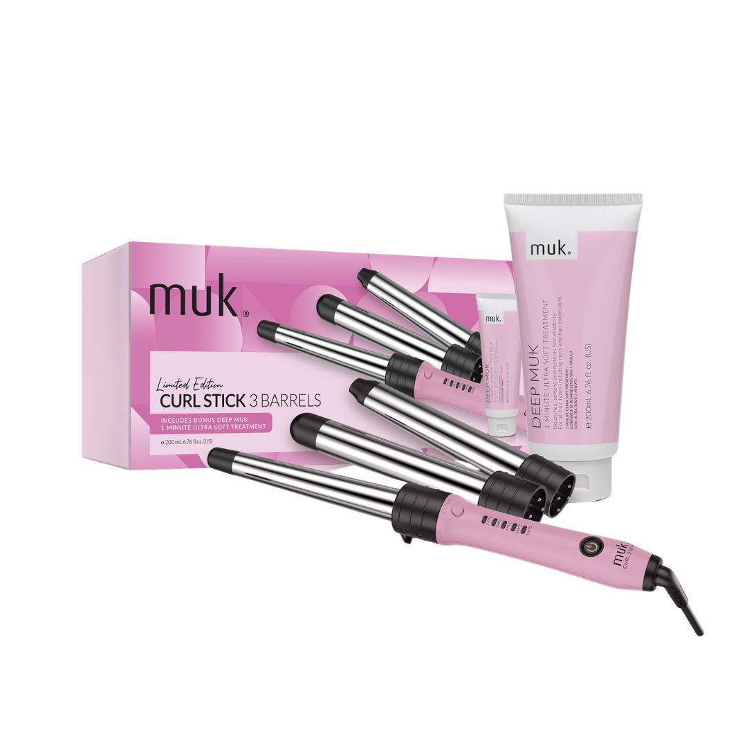 Muk Curl Stick 3 Barrels curling iron set with a pink and silver curling iron, its pink retail box, and a tube of Gel-Muk deep conditioning treatment on a white background.